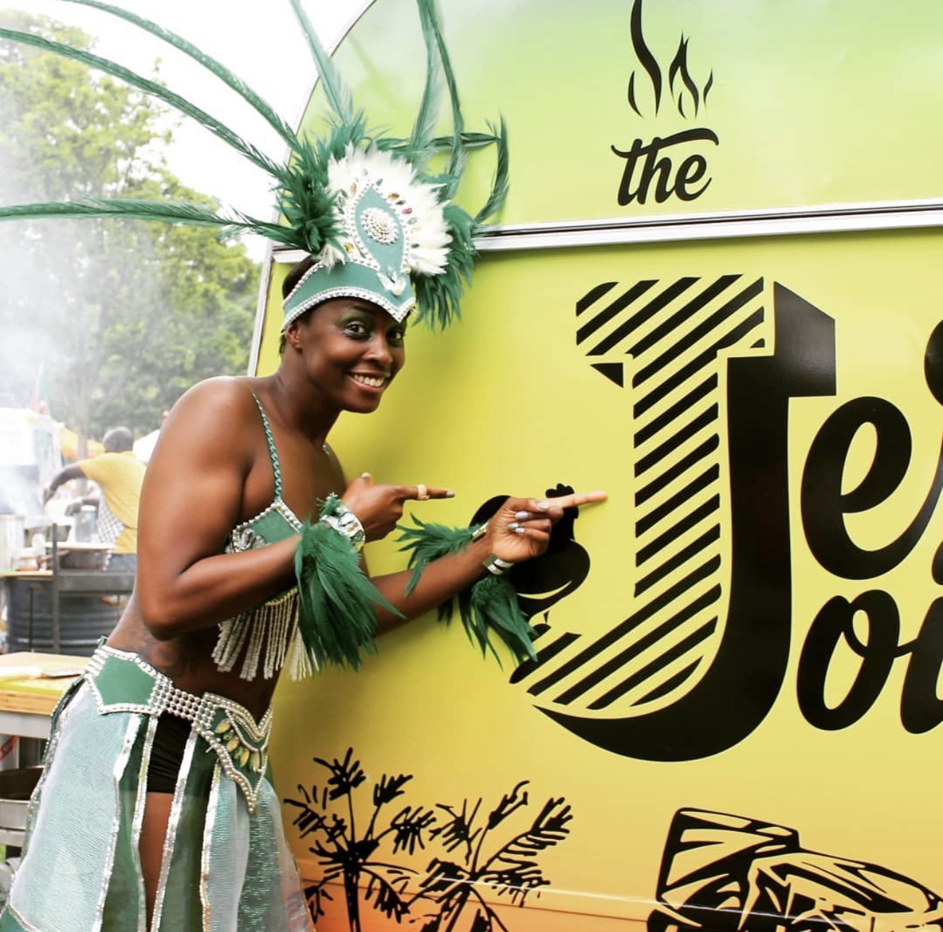 Carnival customer beside The Jerk Joint food van